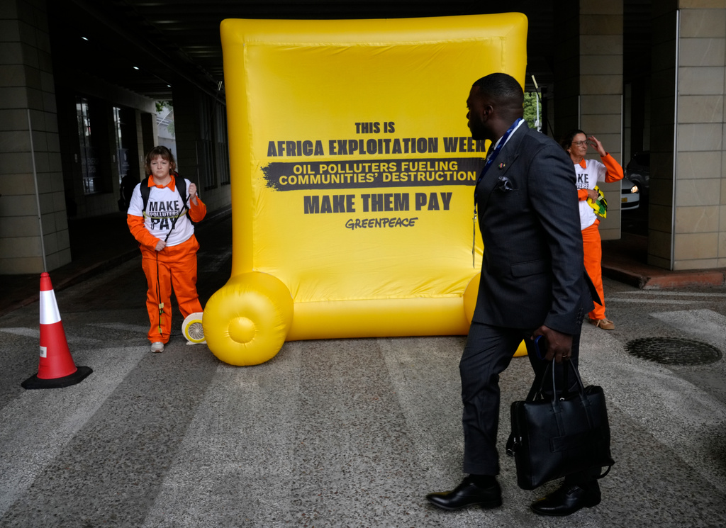 Greenpeace Africa activists protest at the African Energy Week in Cape Town, South Africa, Tuesday, Oct. 13, 2026. (AP Photo/Nardus Engelbrecht)