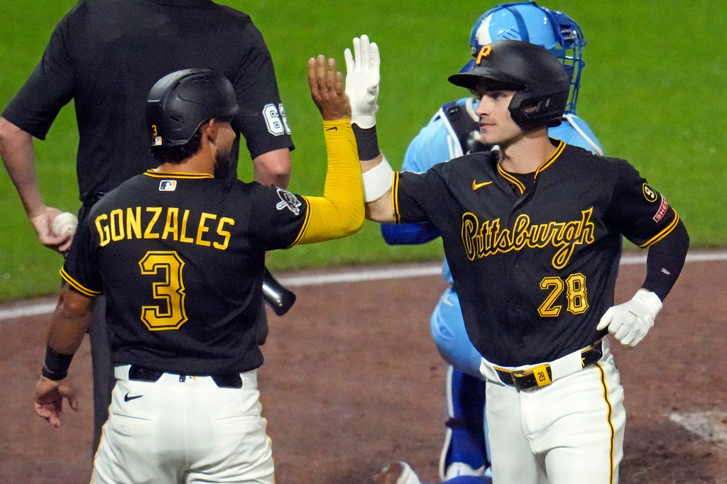 Pittsburgh Pirates' Jake Mangum (28) celebrates with Nick Gonzales (3) after hitting a two-run home run off Kansas City Royals pitcher Noah Cameron during the fourth inning of a baseball game in Pittsburgh, Saturday, Sept. 19, 2026. (AP Photo/Gene J. Puskar)