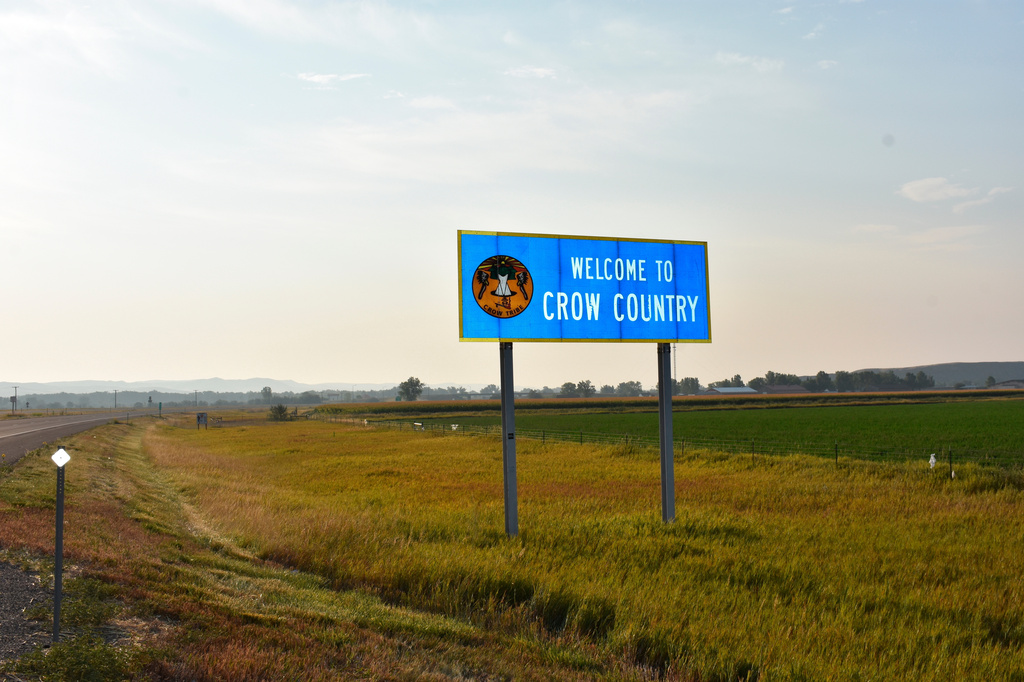 FILE - A sign marking the boundary of the Crow Indian Reservation stands near Hardin, Mont. on Aug. 26, 2020. (AP Photo/Matthew Brown, File)