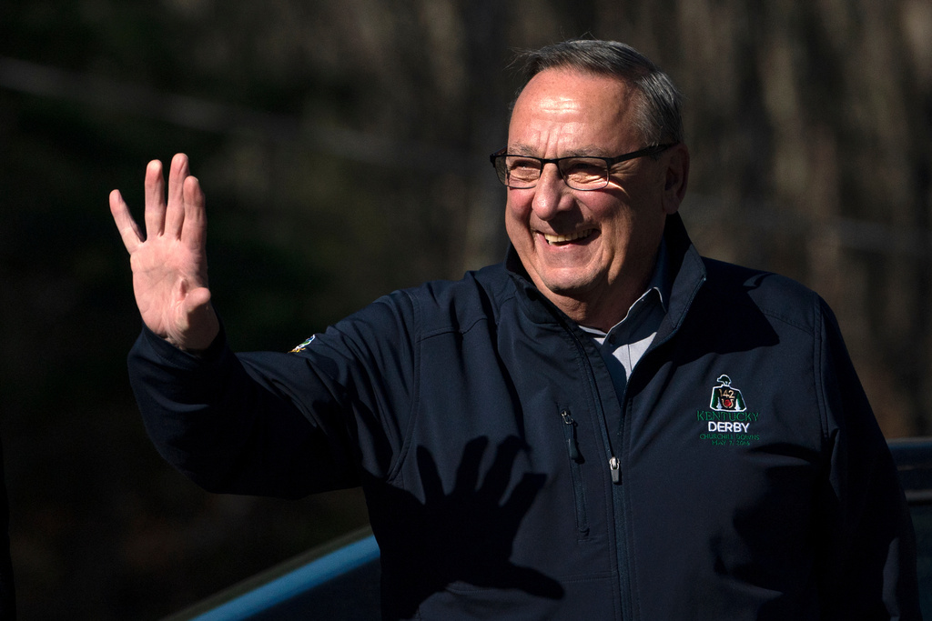 FILE - Republican Paul LePage waves to a supporter outside a polling place, Nov. 8, 2022, in Auburn, Maine. (AP Photo/Robert F. Bukaty)