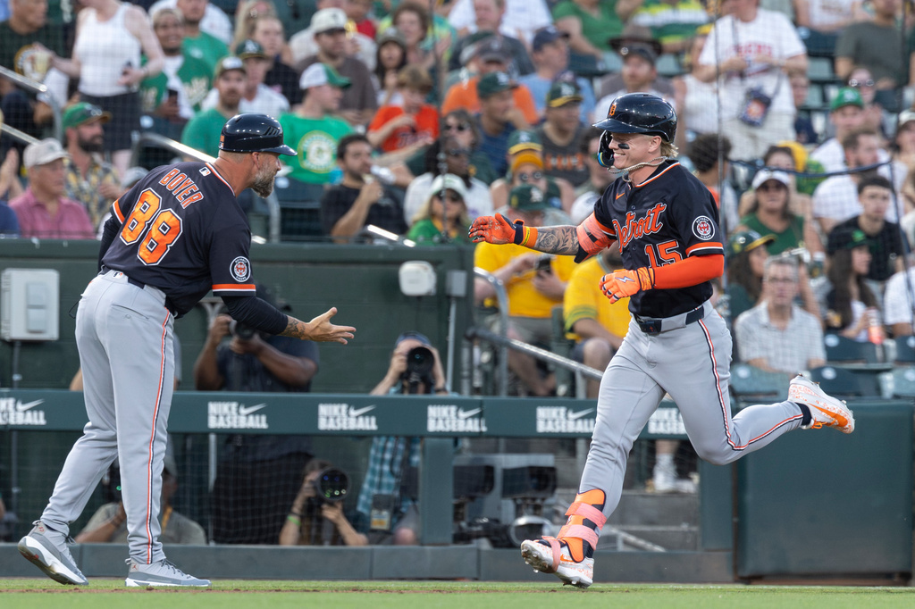 Detroit Tigers' Max Clark, right, greets third base coach Billy Boyer (88) after hitting a two-run home run during the sixth inning of a baseball game against the Athletics, Saturday, Aug. 1, 2026, in West Sacramento, Calif. (AP Photo/Sara Nevis)