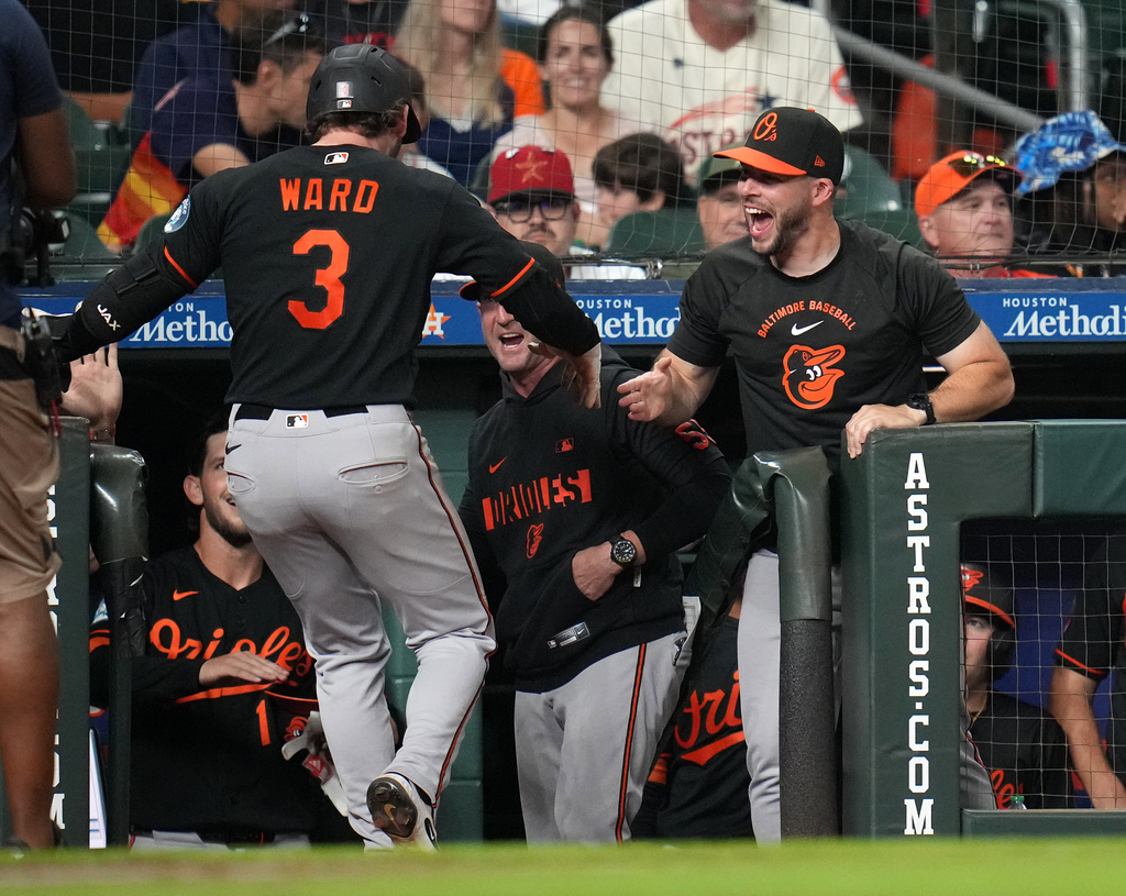 Baltimore Orioles' Taylor Ward (3) celebrates his go-ahead, two-run home run with teammates during the eighth inning of a baseball game against the Houston Astros, Friday, July 17, 2026, in Houston. (AP Photo/Karen Warren)
