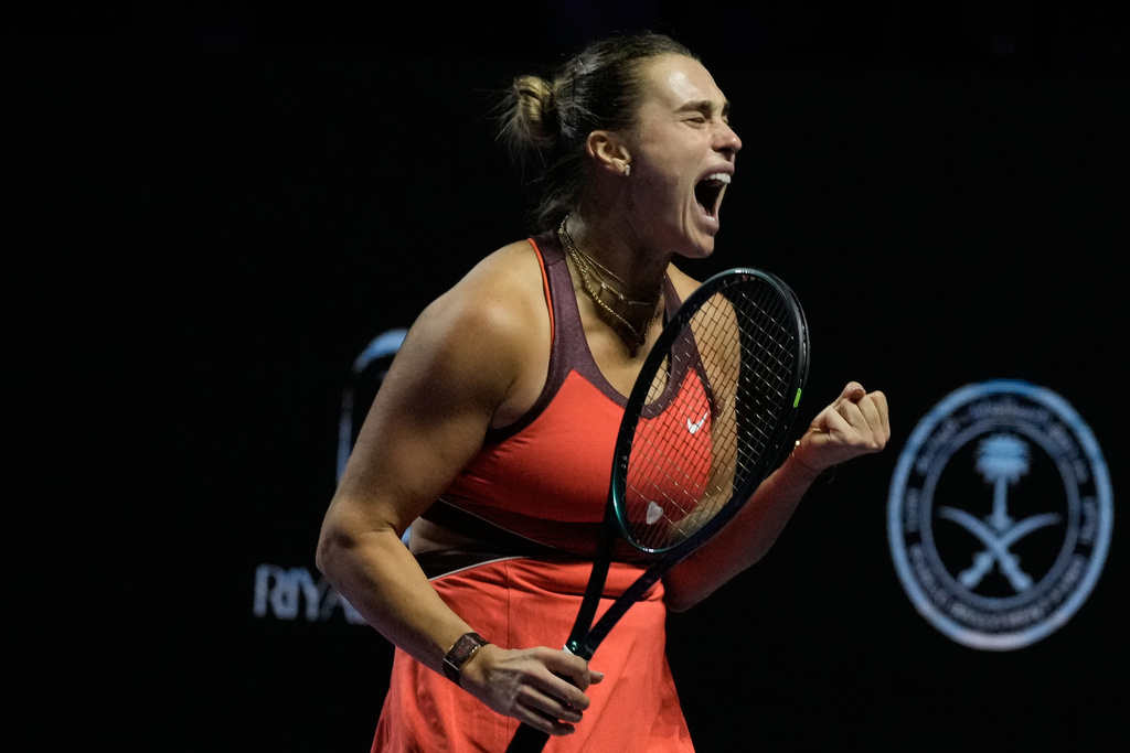 Aryna Sabalenka of Belarus celebrates after winning a point against Amanda Anisimova of the United States during their women's singles semifinal match at the WTA tennis finals in Riyadh, Saudi Arabia, Friday, Nov. 7, 2025. (AP Photo/Fatima Shbair)