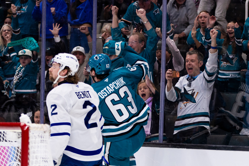 San Jose Sharks center Zack Ostapchuk (63) reacts after scoring against the Toronto Maple Leafs during the first period of an NHL hockey game in San Jose, Calif., Thursday, April 2, 2026. (AP Photo/John Hefti)