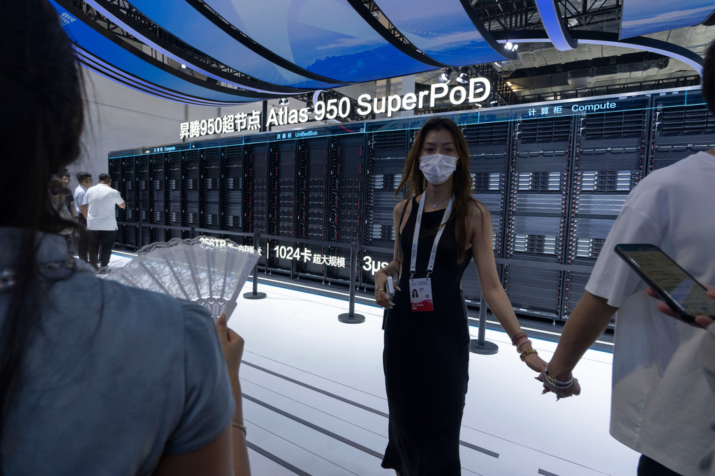 FILE -Visitors stand near the Huawei Atlas 950 SuperPod during the World AI Conference in Shanghai, Friday, July 17, 2026. (AP Photo/Ng Han Guan, File)