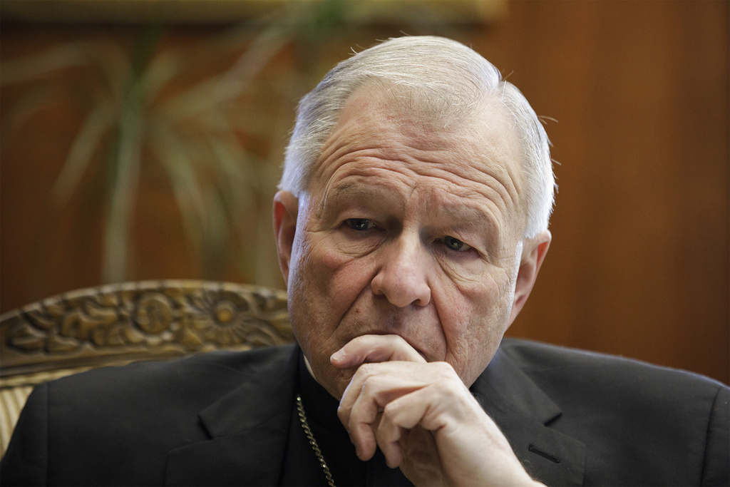 FILE - New Orleans Archbishop Gregory Aymond talks with NOLA.com|The Times Picayune at the archdiocese office in New Orleans, March 27, 2019. (David Grunfeld/NOLA.com/The Advocate via AP, File)