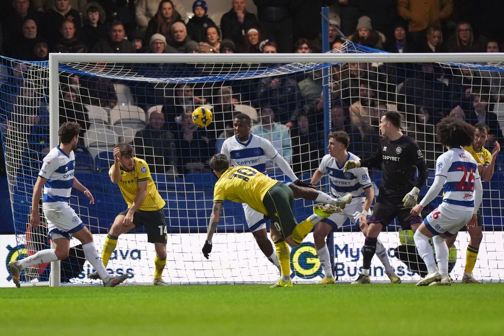 Wrexham's Josh Windass, third left, scores their side's second goal of the game during the Sky Bet Championship soccer match between Queens Park Rangers and Wrexham in London, Saturday Jan. 24, 2026. (Ben Whitley/PA via AP)