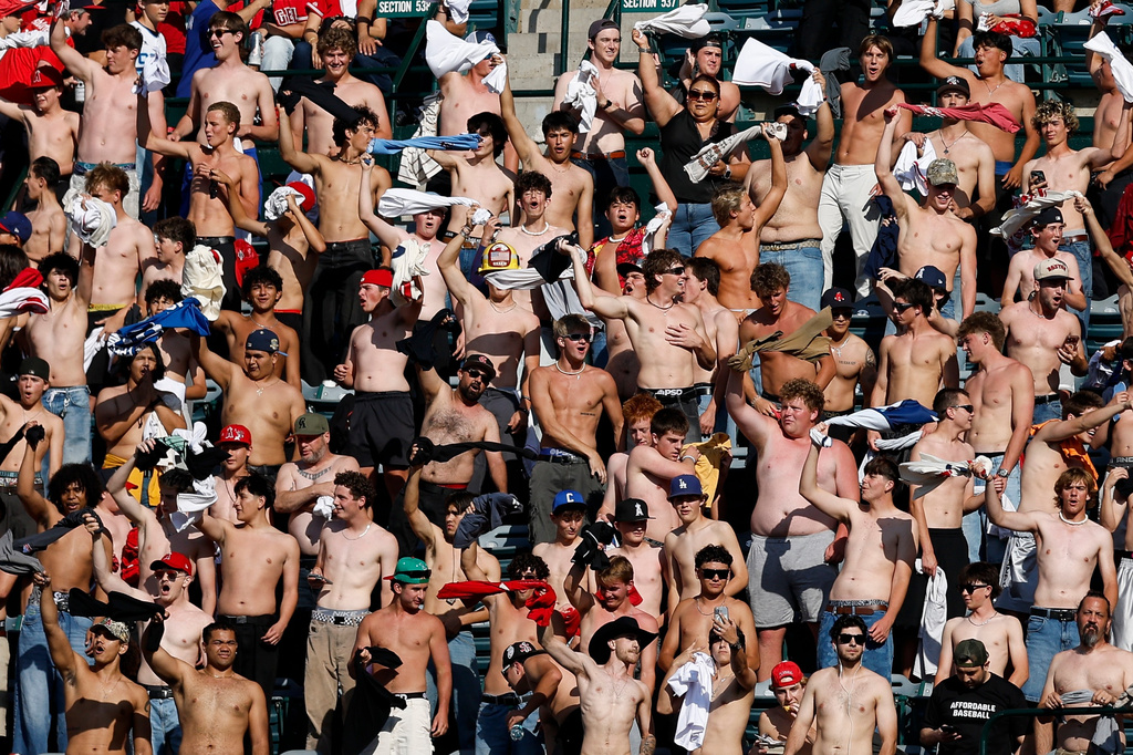 Fans participate go "tarps off" during the fifth inning of a baseball game between the Texas Rangers and the Los Angeles Angels, Sunday, May 24, 2026, in Anaheim, Calif. (AP Photo/Caroline Brehman)