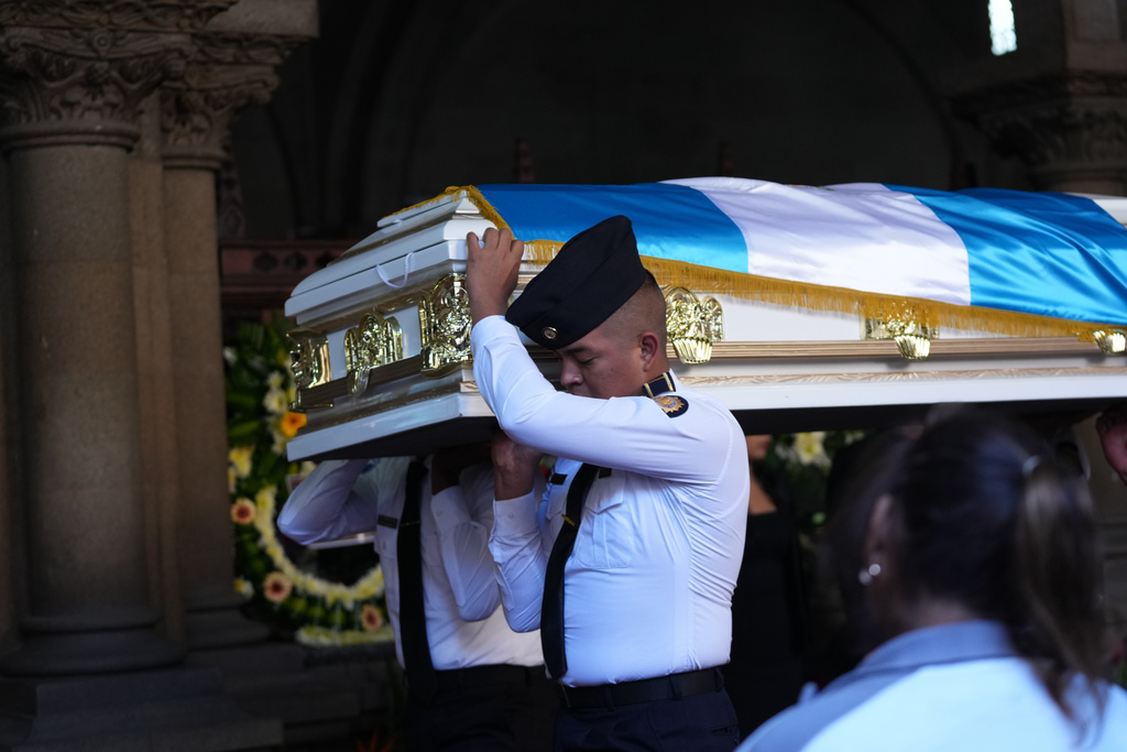 The wake for police officers killed while retaking control of three prisons is held at the Interior Ministry in Guatemala City, Monday, Jan. 19, 2026. (AP Photo/Moises Castillo)