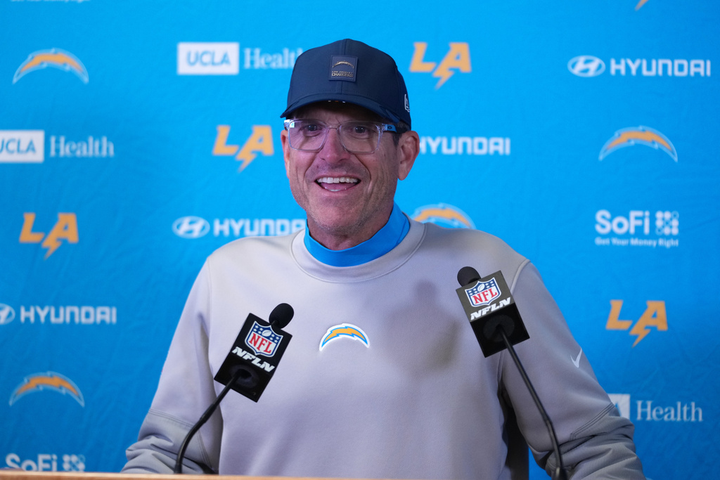 Los Angeles Chargers head coach Jim Harbaugh speaks during a news conference following an NFL football game against the Kansas City Chiefs Sunday, Dec. 14, 2025, in Kansas City, Mo. (AP Photo/Ed Zurga)