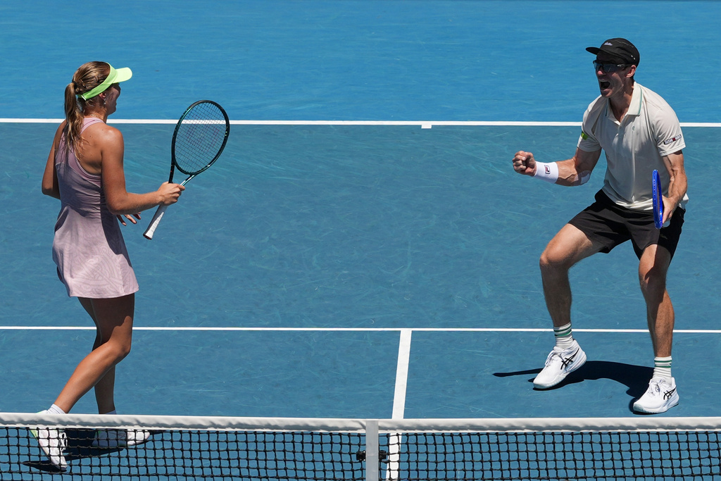 Australia's Olivia Gadecki and John Peers in action against France's Kristina Mladenovic and Manuel Guinard in the mixed doubles final at the Australian Open tennis championship in Melbourne, Australia, Friday, Jan. 30, 2026. (AP Photo/Aaron Favila)