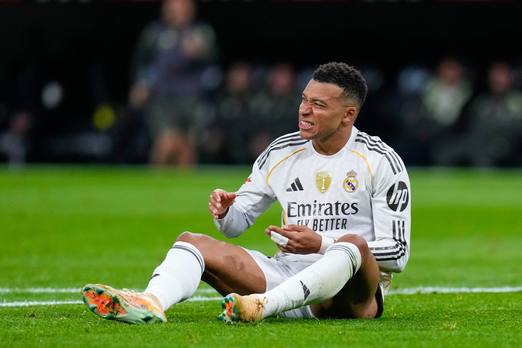 Real Madrid's Kylian Mbappe reacts during the Spanish La Liga soccer match between Real Madrid and Celta Vigo in Madrid, Spain, Sunday, Dec. 7, 2025. (AP Photo/Manu Fernandez)