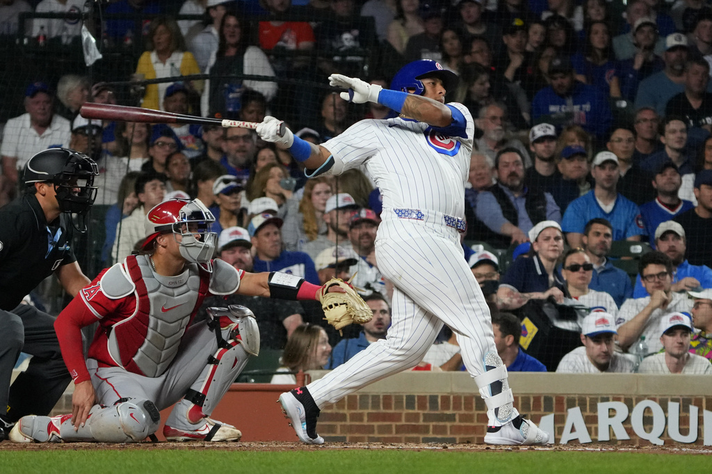 Chicago Cubs' Moisés Ballesteros hits a two-run single against the Los Angeles Angels during the third inning in a baseball game Monday, March 30, 2026, in Chicago. (AP Photo/David Banks)