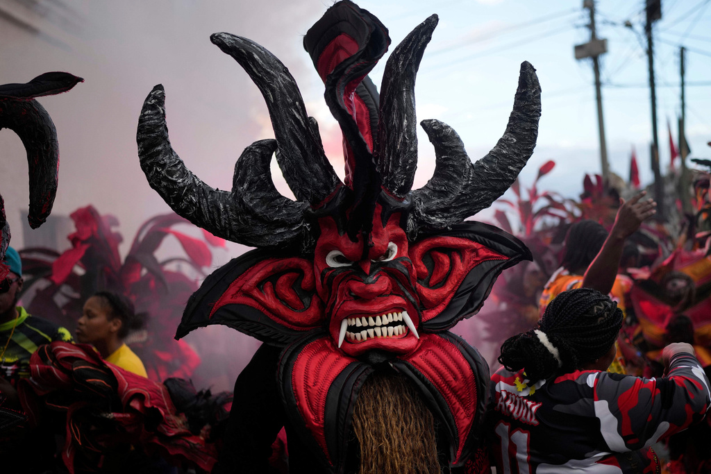 Revelers take part in the Devils and Congos Festival, in Portobelo, Panama, May 3, 2025. (AP Photo/Matias Delacroix, File)