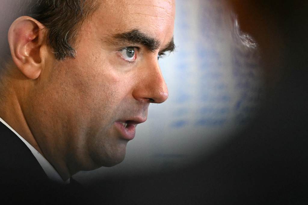 Reappointed French Prime Minister Sebastien Lecornu looks on as he visits a police station in L'Hay-les-Roses, outside Paris, Saturday, Oct. 11, 2025. (Martin Lelievre, Pool Photo via AP)