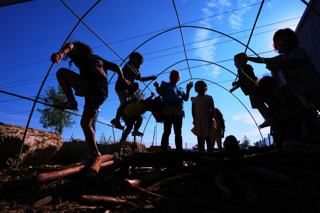 Pre-K 4 SA students play on the playground, Oct. 9, 2025, in San Antonio. (AP Photo/Eric Gay)