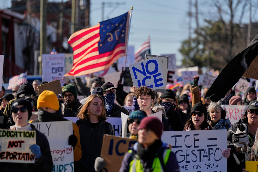 People demonstrate during a march calling for an end to federal immigration enforcement operations Sunday, Jan. 11, 2026, in Nashville, Tenn. (AP Photo/George Walker IV)