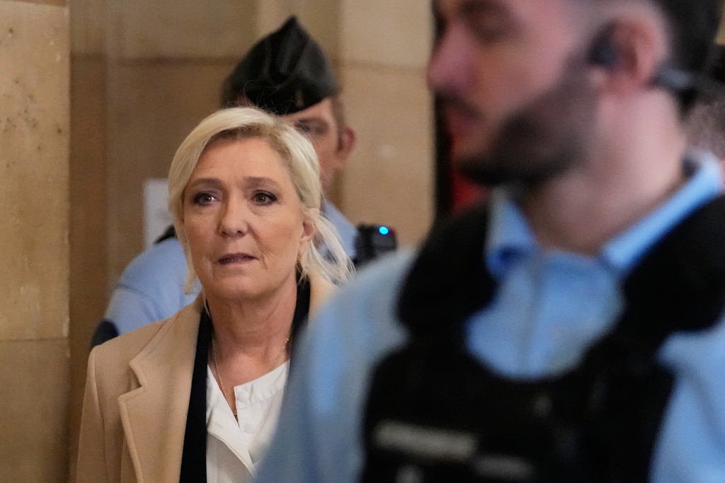 Far-right leader Marine Le Pen arrives for her appeal trial, in Paris, France, Wednesday, Feb. 11, 2026. (AP Photo/Michel Euler)