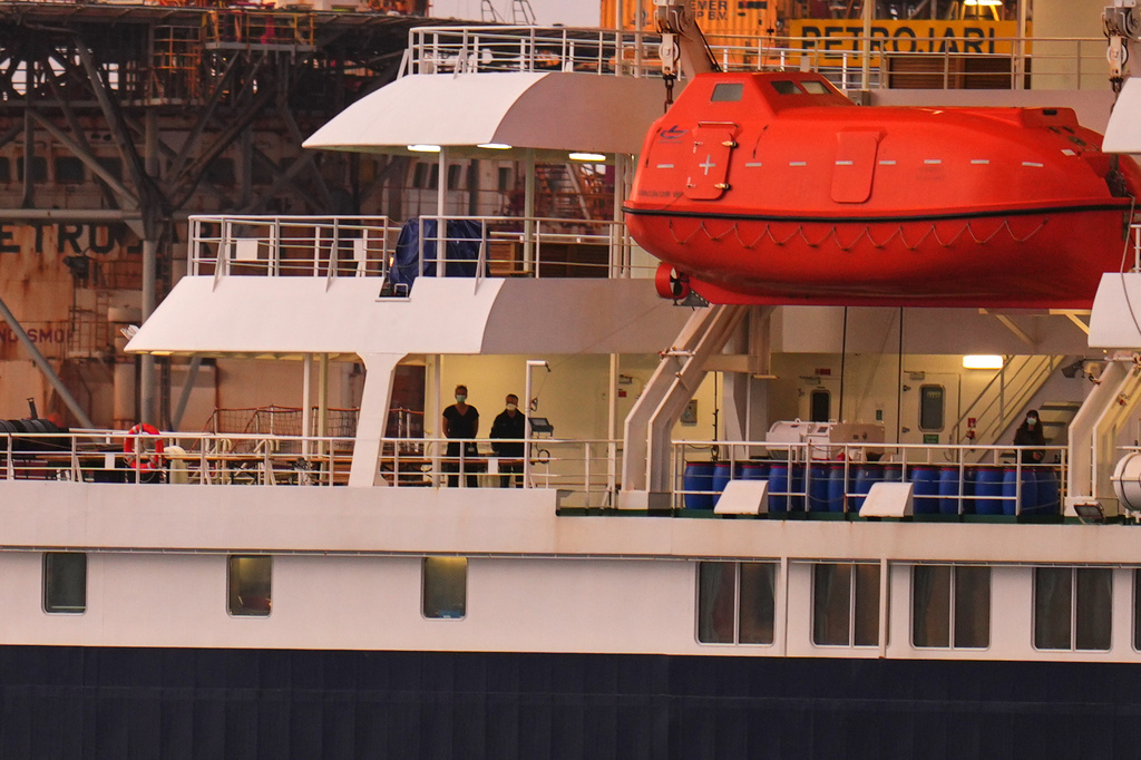 Passengers at the hantavirus-stricken cruise ship MV Hondius after arriving at the port of Granadilla in Tenerife, Canary Islands, Spain, Sunday, May 10, 2026. (AP Photo/Manu Fernandez)