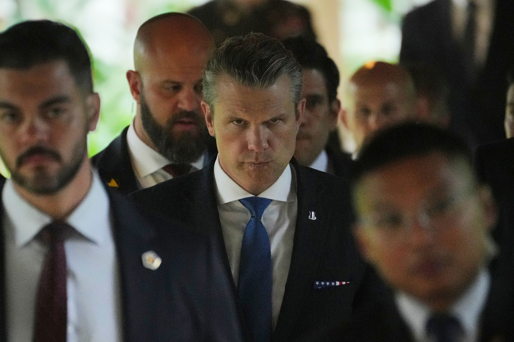 U.S. Secretary of Defense Pete Hegseth, center, walks after attending several bilateral meetings on the sidelines of the Shangri-La Dialogue, Asia's annual defense and security forum, in Singapore, Friday, May 29, 2026. (AP Photo/Achmad Ibrahim)