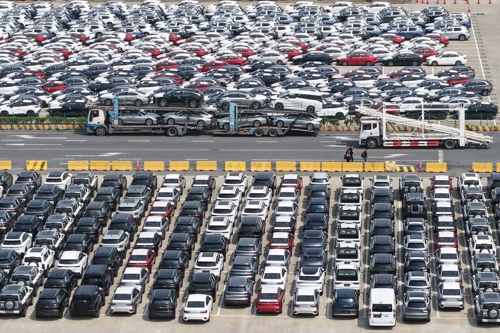 Aerial view of new vehicles waiting for shipment to overseas market at a port in Shanghai, China Saturday, May 9, 2026.(Chinatopix via AP)