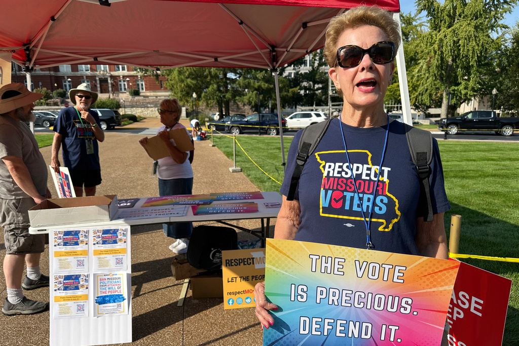 Liz Kester, a volunteer with the Respect Missouri Voters Coalition, explains her support for a ballot initiative limiting legislative powers while at the Missouri Capitol lawn on Wednesday, Sept. 10, 2025 in Jefferson City, Mo. (AP Photo/David A. Lieb)