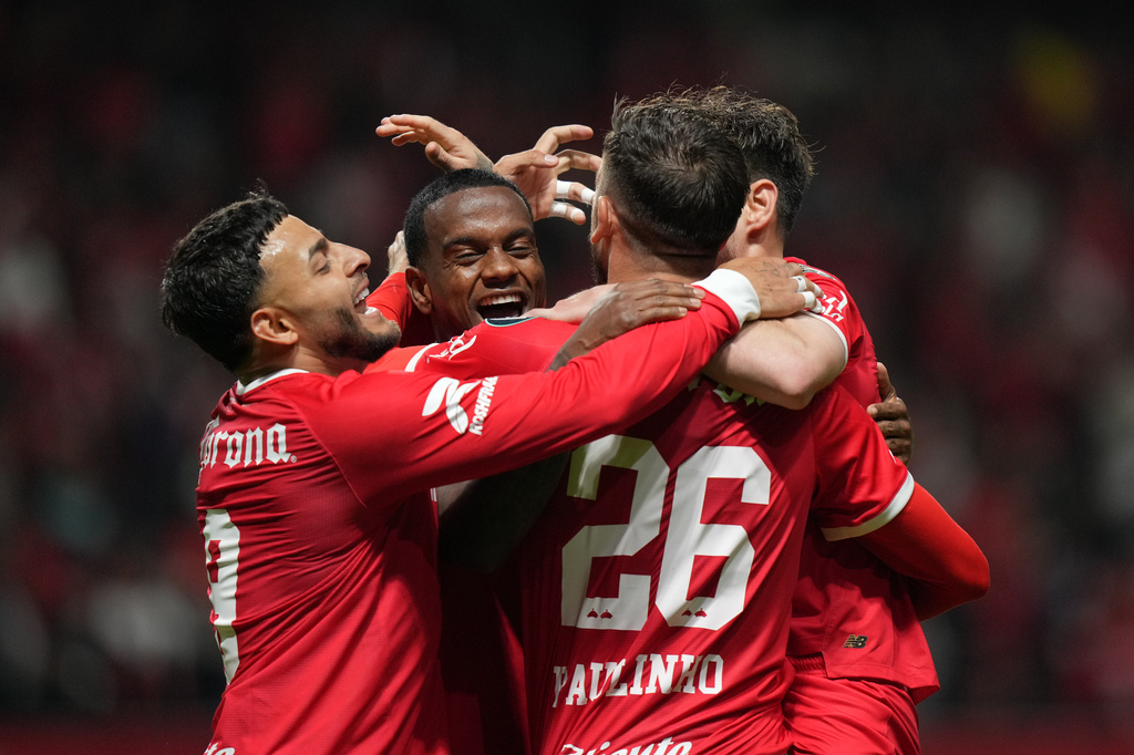 Paulinho of Mexico's Toluca (26) is congratulated after scoring his side's 2nd goal against the United States' LA Galaxy during a CONCACAF Champions Cup quarterfinal first leg soccer match in Toluca, Mexico, Wednesday, April 8, 2026. (AP Photo/Fernando Llano)