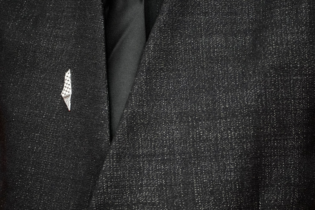 Filipino-Australian filmmaker James J. Robinson wears a pro-Palestinian pin representing the pre-1948 map while posing for a photo on the red carpet during 22nd Marrakech Film Festival, in Morocco, Tuesday, Dec. 2, 2025. (AP Photo/Mosa'ab Elshamy)