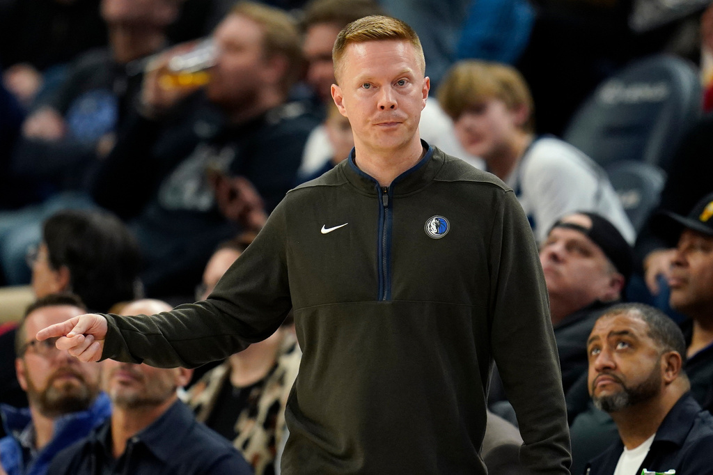 FILE - Dallas Mavericks assistant coach Sean Sweeney directs the team during the second half of an NBA basketball game against the Minnesota Timberwolves, Dec. 19, 2022, in Minneapolis. (AP Photo/Abbie Parr, File)