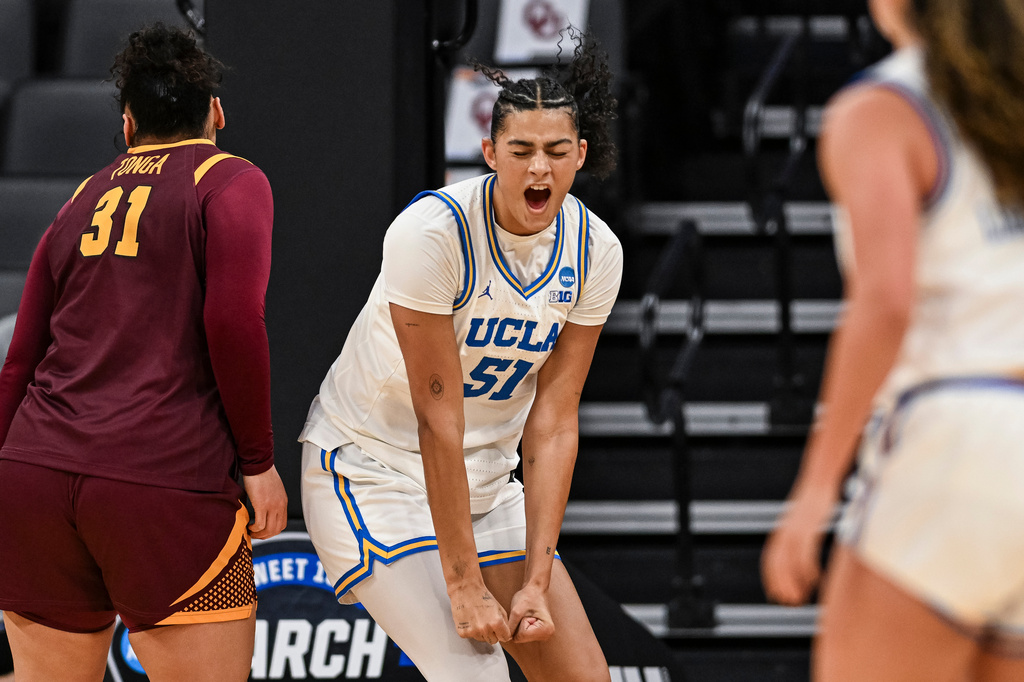 UCLA center Lauren Betts (51) reacts against Minnesota during the first half in the Sweet 16 of the NCAA college basketball tournament Friday, March 27, 2026, in Sacramento, Calif. (AP Photo/Justine Willard)