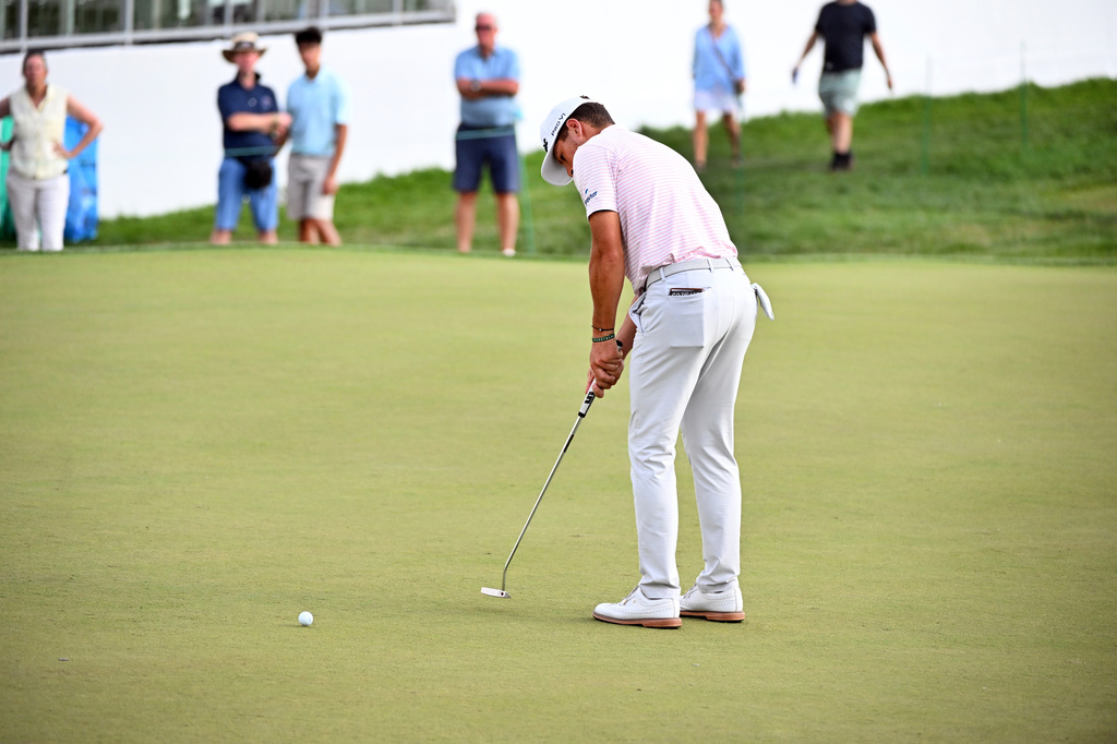 Michael Brennan putts on the 18th green during the first round of the Rocket Classic golf tournament at the Detroit Golf Club, Thursday, July 30, 2026, in Detroit. (AP Photo/Jose Juarez)
