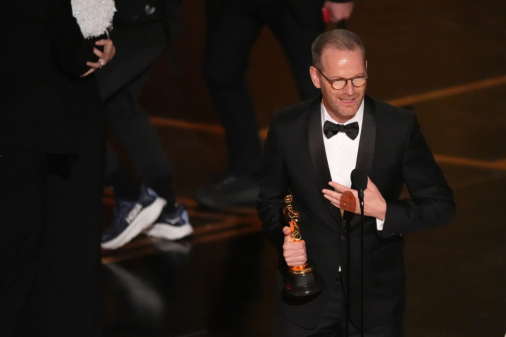 Joachim Trier accepts the award for international feature film for "Sentimental Value" during the Oscars on Sunday, March 15, 2026, at the Dolby Theatre in Los Angeles. (AP Photo/Chris Pizzello)