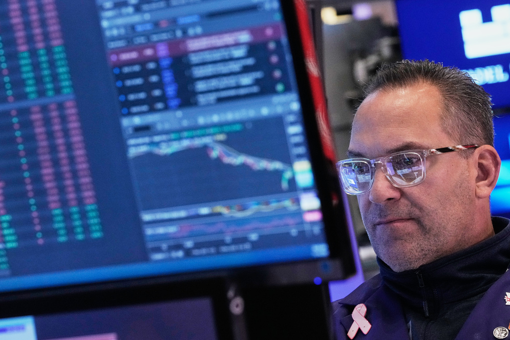Specialist Anthony Matesic works on the floor of the New York Stock Exchange, Friday, Nov. 14, 2025. (AP Photo/Richard Drew)