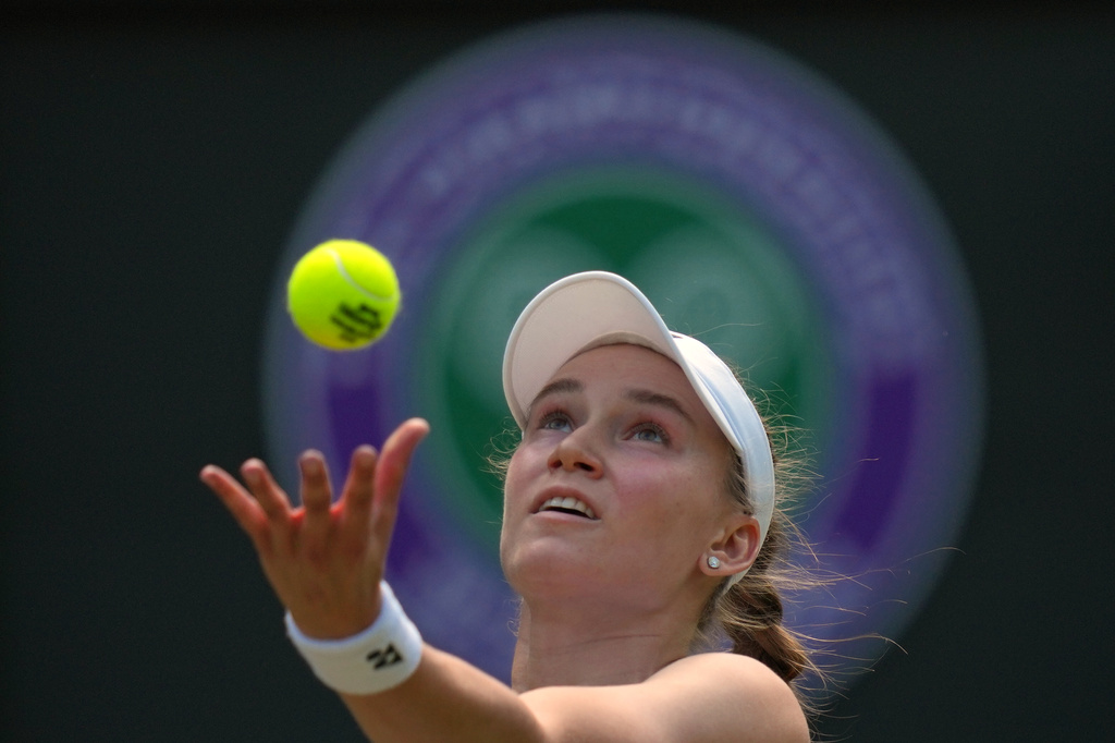 Elena Rybakina of Kazakhstan serves against Elise Mertens of Belgium in their third round women's singles match at the Wimbledon Tennis Championships in London, Saturday, July 4, 2026. (AP Photo/Kirsty Wigglesworth)