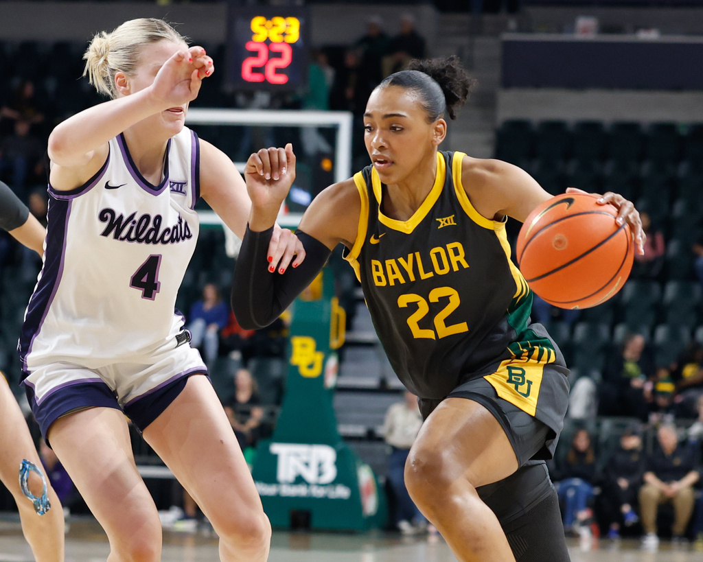 Baylor forward Bella Fontleroy (22) drives to the basket as Kansas State forward Nastja Claessens (4) defends in the first half of an NCAA college basketball game, Monday, Feb. 23, 2026, in Waco, Texas. (Chris Jones/Waco Tribune-Herald via AP)