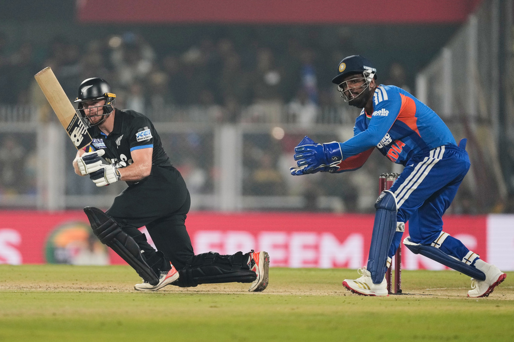 New Zealand's Glenn Phillips plays a shot during the third T20 cricket match between India and New Zealand in Guwahati, India, Sunday, Jan. 25, 2026. (AP Photo/Anupam Nath)