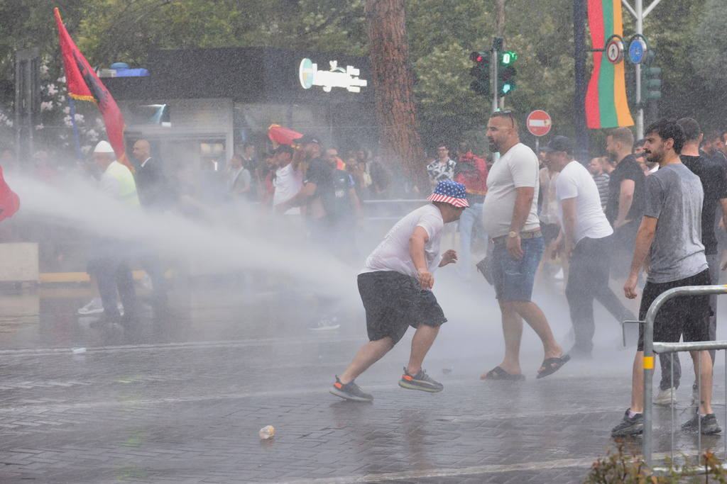 Police use a water cannon to disperse protesters during a demonstration in Tirana, Albania, Wednesday, June 3, 2026, opposing a luxury coastal development project linked to Jared Kushner and Ivanka Trump over concerns about environmental impacts and transparency. (AP Photo/Hameraldi Agolli)