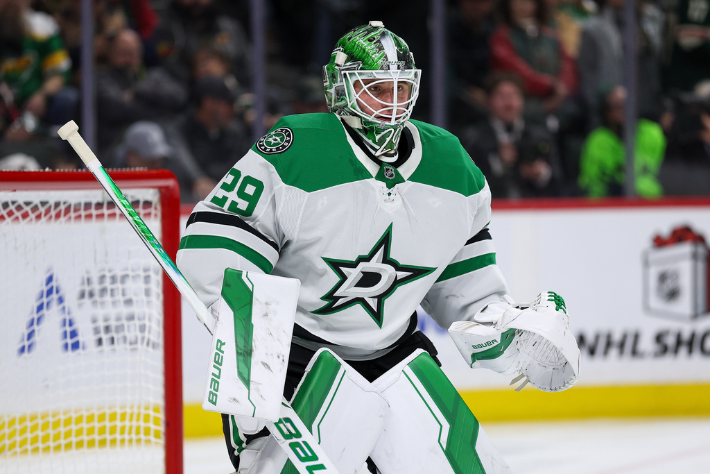 Dallas Stars goaltender Jake Oettinger (29) defends his net against the Minnesota Wild during the second period of an NHL hockey game Thursday, Dec. 11, 2025, in St. Paul, Minn. (AP Photo/Matt Krohn)