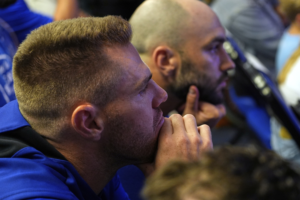Los Angeles Dodgers' Freddie Freeman, left, listens as pitcher Clayton Kershaw speaks to the media after announcing his retirement at the end of the season prior to a baseball game against the Philadelphia Phillies Thursday, Sept. 18, 2025, in Los Angeles. (AP Photo/Mark J. Terrill)