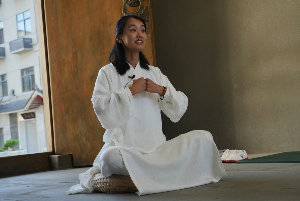 Guo Xinyi, a Chinese student at the Wudang Taoist Traditional Kung Fu Academy, speaks during an interview near Wudang Mountain in Shiyan city in central China's Hubei province on Friday, Sept. 4, 2026. (AP Photo/Achmad Ibrahim)