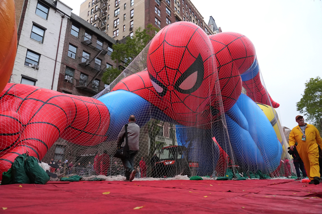 Volunteers pass a Spider-Man balloon during preparations for the 99th Macy's Thanksgiving Day Parade Wednesday, Nov. 26, 2025, in New York. (AP Photo/Frank Franklin II)