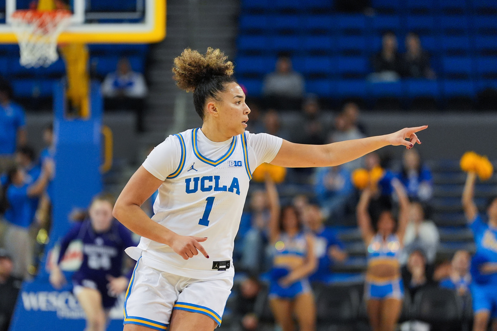 UCLA guard Kiki Rice (1) points to a teammate during the first half of an NCAA women's college basketball game against Washington in Los Angeles, Thursday, Feb. 19, 2026. (AP Photo/Jae C. Hong)