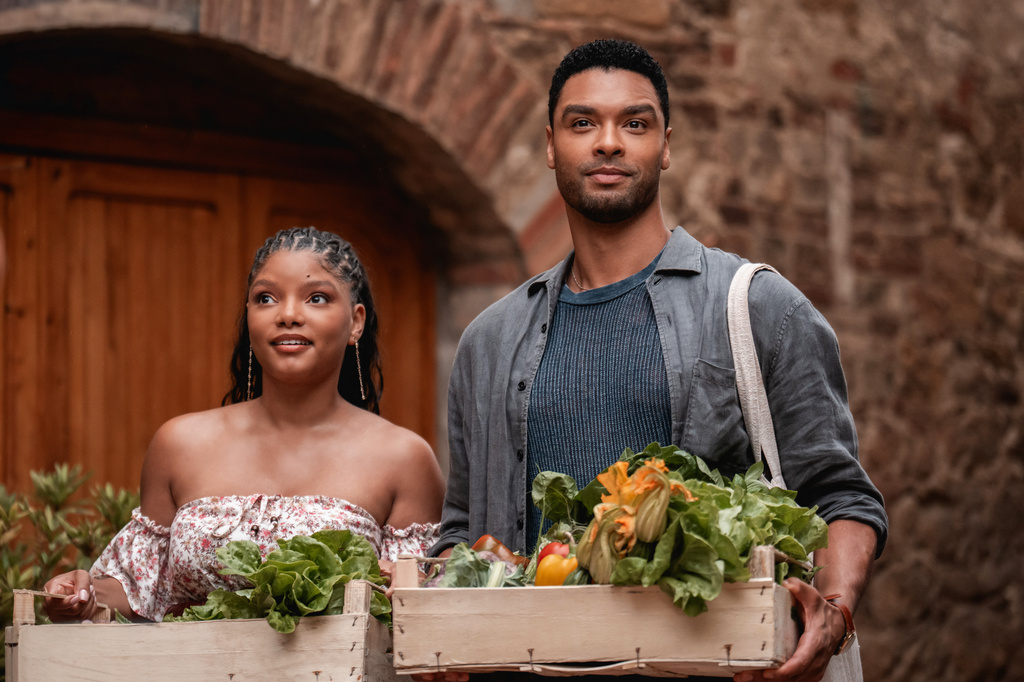 This image released by Universal Pictures shows Halle Bailey, left, and Regé-Jean Page in a scene from "You, Me & Tuscany." (Giulia Parmigiani/Universal Pictures via AP)