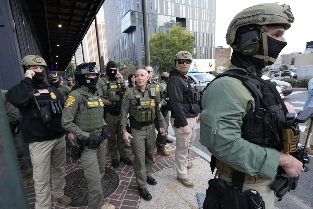 FILE - U.S. Border Patrol Commander at large Gregory Bovino, center, walks on the street in New Orleans, La., Dec. 3, 2025. (AP Photo/Gerald Herbert, File)