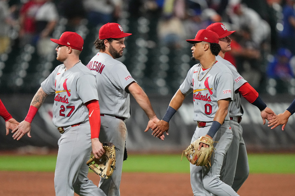 St. Louis Cardinals' Alec Burleson, center, Masyn Winn, right, and Nathan Church, right, celebrates with teammates after a baseball game against the New York Mets Tuesday, June 9, 2026, in New York. (AP Photo/Frank Franklin II)
