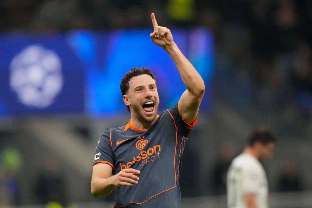 Inter Milan's Carlos Augusto celebrates after scoring his side's second goal during the Champions League opening phase soccer match between Inter Milan and Kairat Almaty in Milan, Italy, Wednesday, Nov. 5, 2025. (AP Photo/Luca Bruno)