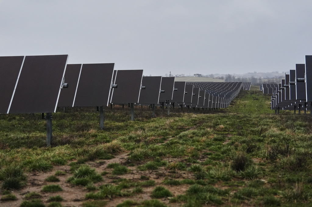 Solar panels operate Wednesday, Jan. 14, 2026, at a farm in Lancaster, Ky. (AP Photo/Joshua A. Bickel)