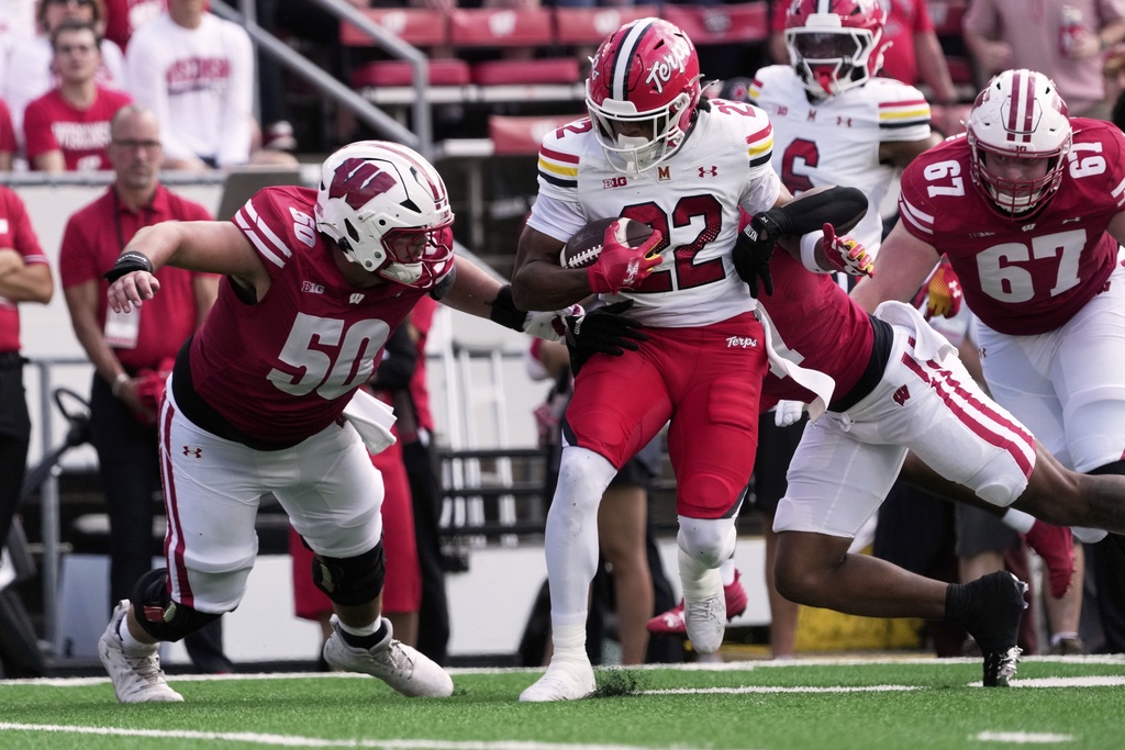 Maryland's Jalen Huskey runs back an interception during the first half of an NCAA college football game against Wisconsin Saturday, Sept. 20, 2025, in Madison, Wis. (AP Photo/Morry Gash)