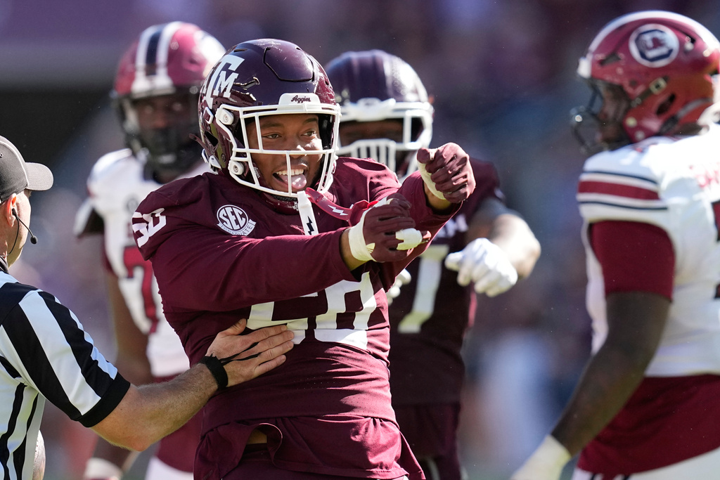 Texas A&M defensive end Dayon Hayes (50) celebrates after sacking South Carolina quarterback Lanorris Sellers during the second half of an NCAA college football game Saturday, Nov. 15, 2025, in College Station, Texas. (AP Photo/David J. Phillip)