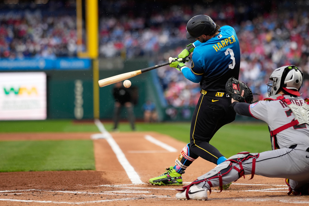Philadelphia Phillies' Bryce Harper hits a double against Cleveland Guardians pitcher Gavin Williams during the first inning of a baseball game Friday, May 22, 2026, in Philadelphia. (AP Photo/Matt Slocum)
